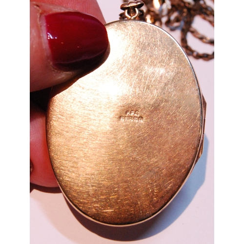 30 - 9ct gold oval locket, part engine turned, with necklet, 20g gross.