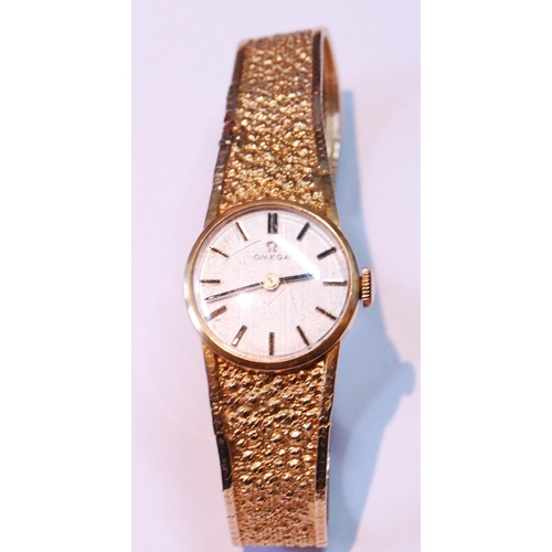 127 - Lady's Omega 9ct gold bracelet watch, 1975, 19g gross.