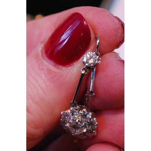 4 - Pair of diamond drop earrings, each with a cluster of nine-old cut brilliants dependant from another... 