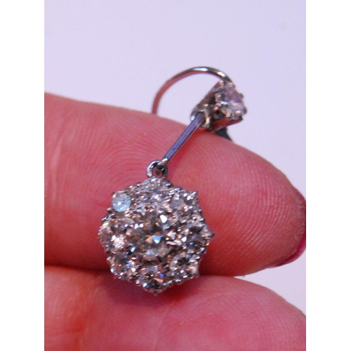 4 - Pair of diamond drop earrings, each with a cluster of nine-old cut brilliants dependant from another... 