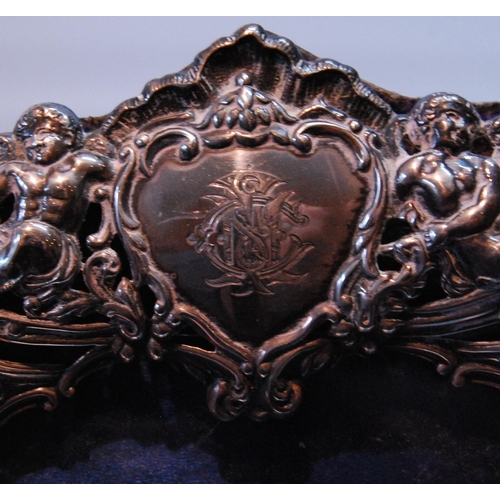 90 - Silver photograph frame pierced with putti and scrolls, by W Comyns, 1895, 22cm x 17cm, and another.... 