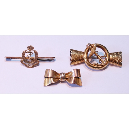 6 - Gold bow brooch, ‘9ct’, another, formerly a bracelet mount with fouled anchor, and anoth... 
