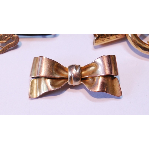 6 - Gold bow brooch, ‘9ct’, another, formerly a bracelet mount with fouled anchor, and anoth... 