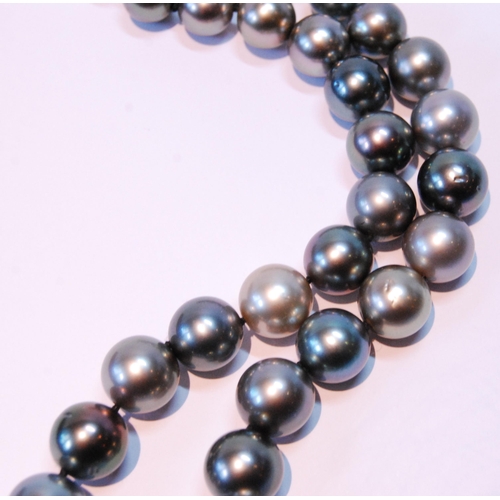 47 - Black and tinted pearl necklet on diamond-set gold ball snap, '750', by JKa Koehle.