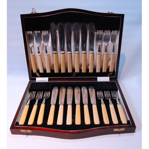 96 - Set of twelve silver fish knives and twelve forks (Xylonite handles) by Cooper Brothers & Sons, ... 