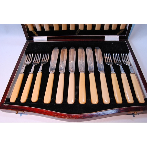 96 - Set of twelve silver fish knives and twelve forks (Xylonite handles) by Cooper Brothers & Sons, ... 