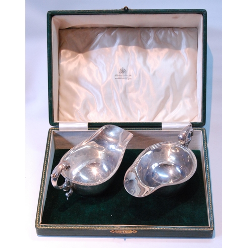 98 - Pair of silver sauce boats with gadrooned edges, on collet feet, by S Blankensee & Sons, for Edw... 