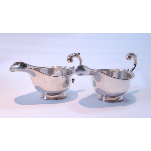 98 - Pair of silver sauce boats with gadrooned edges, on collet feet, by S Blankensee & Sons, for Edw... 