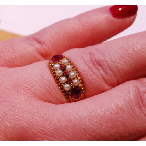 60 - Victorian ring with pearls and rubies on engraved band, in 15ct gold, 1877, size R, 2.8g gross.