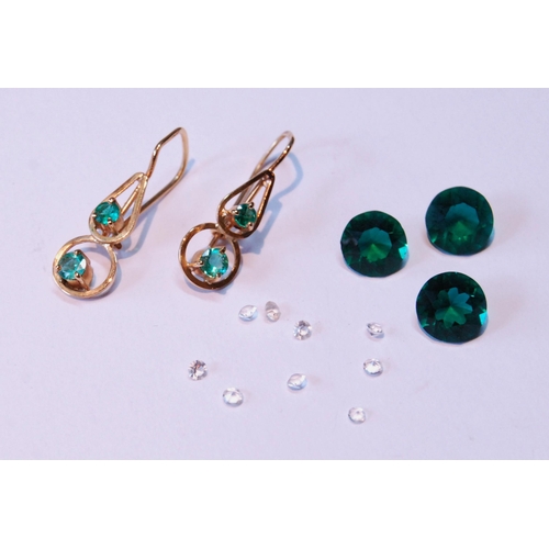 61 - Pair of gold wire earrings, each with two emeralds, also various gems.