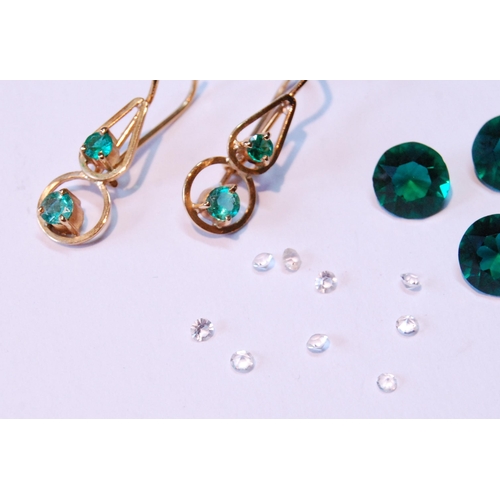 61 - Pair of gold wire earrings, each with two emeralds, also various gems.