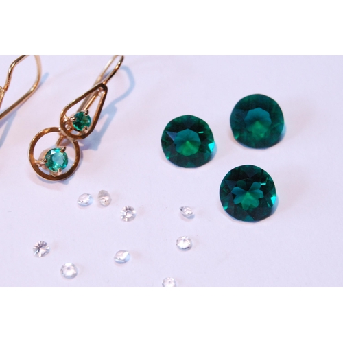 61 - Pair of gold wire earrings, each with two emeralds, also various gems.