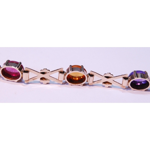 63 - 9ct gold bracelet with cabochon garnet, citrine, amethyst and other gems, 15.5g gross.