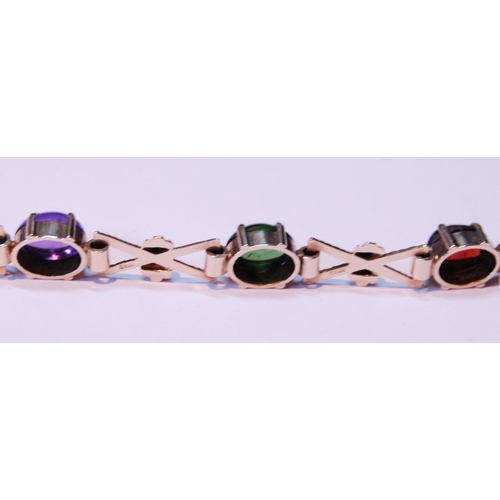 63 - 9ct gold bracelet with cabochon garnet, citrine, amethyst and other gems, 15.5g gross.