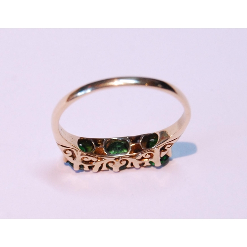 67 - Demantoid garnet three-stone ring with four diamond brilliants, '18ct' (uncertificated), size S.