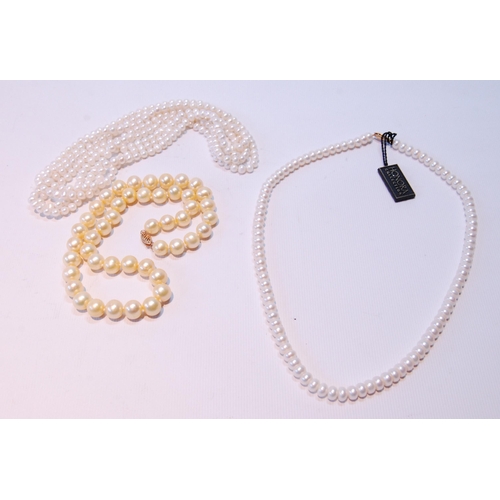 68 - Two pearl necklets with gold snaps and another, opera length.  (3)