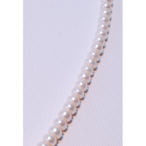 68 - Two pearl necklets with gold snaps and another, opera length.  (3)