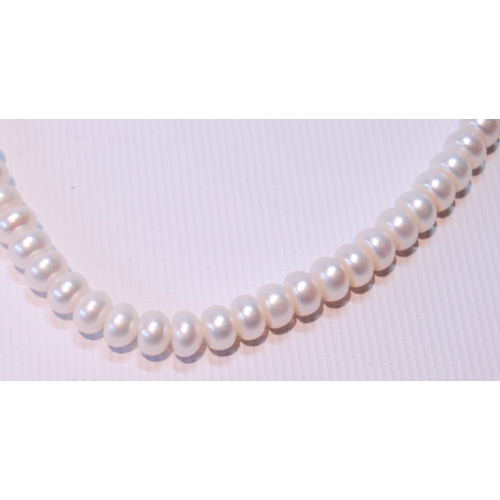 68 - Two pearl necklets with gold snaps and another, opera length.  (3)