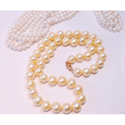 68 - Two pearl necklets with gold snaps and another, opera length.  (3)