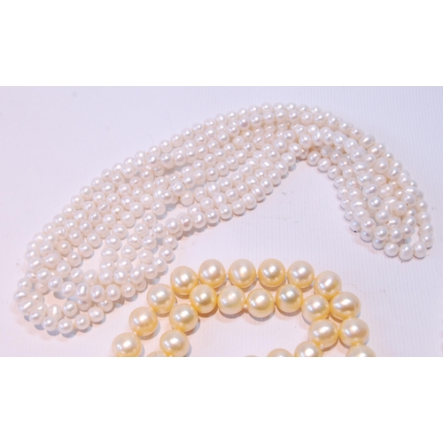 68 - Two pearl necklets with gold snaps and another, opera length.  (3)