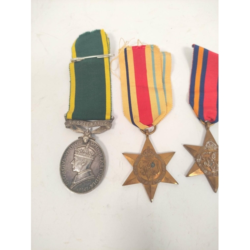 207 - WW2. Medal group presented to Gnr R. Nesbitt R.A 874148 comprising of Territorial Efficiency Medal, ... 