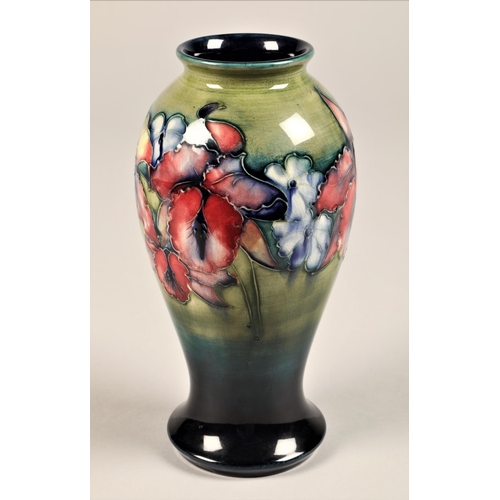 55 - Moorcroft pottery vase, baluster form, decorated with orchid pattern, signed and incised Moorcroft, ... 