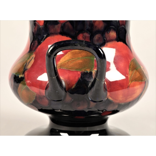 56 - Large Moorcroft pottery campana vase, decorated with pomegranate pattern, signed and incised Moorcro... 