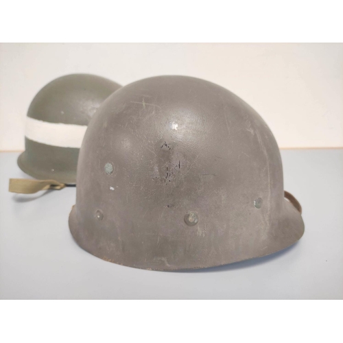 210 - USA WW2 era M1 helmet with military police markings c1944. Original olive green textured painting an... 