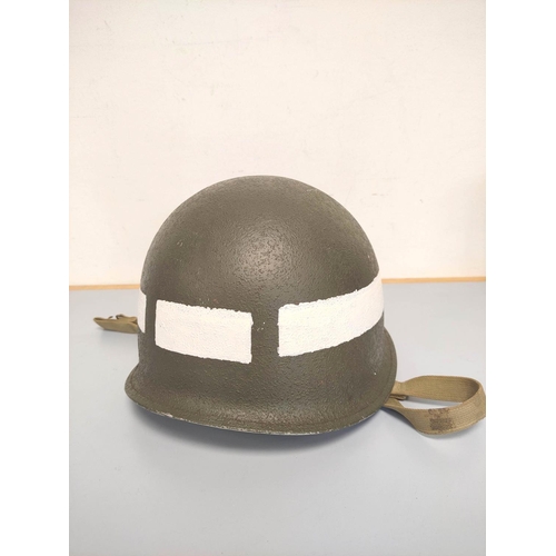 210 - USA WW2 era M1 helmet with military police markings c1944. Original olive green textured painting an... 