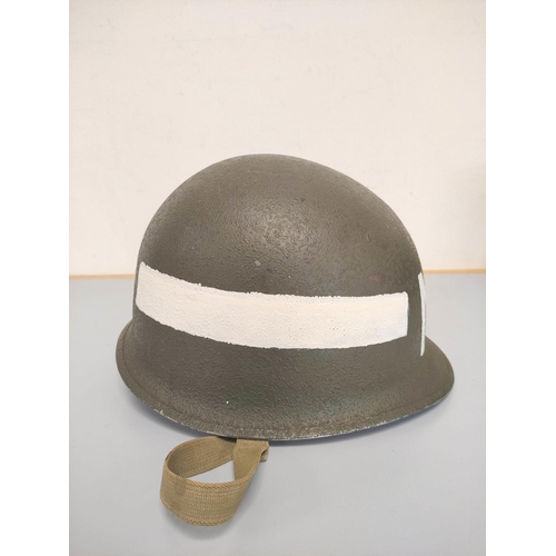 210 - USA WW2 era M1 helmet with military police markings c1944. Original olive green textured painting an... 