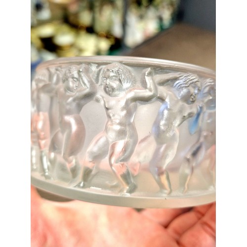 11 - Lalique glass jar with cover, with classical figures in relief, 11 cm diameter, 9 cm high with cover... 