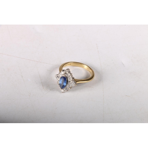 156 - 18ct gold marquise cut sapphire surrounded by clear stones, size J