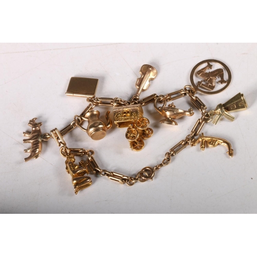 160 - 9ct gold charm bracelet, most charms marked 9ct, 19g.