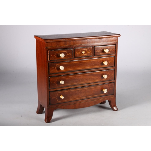 348 - 19th Century mahogany apprentice chest of three short over three long drawers on boxwood bracket fee... 