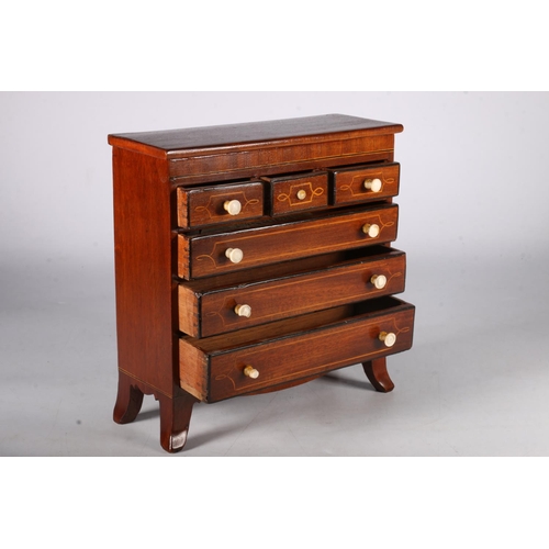 348 - 19th Century mahogany apprentice chest of three short over three long drawers on boxwood bracket fee... 