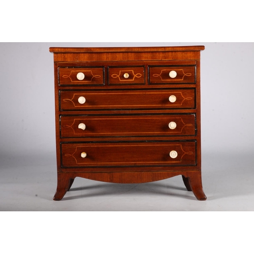 348 - 19th Century mahogany apprentice chest of three short over three long drawers on boxwood bracket fee... 