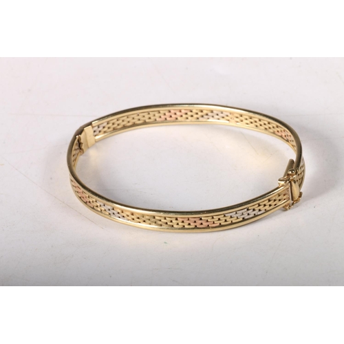 201 - 9ct multi tone gold basket weave hinged bangle, 7cm, 10.9g.