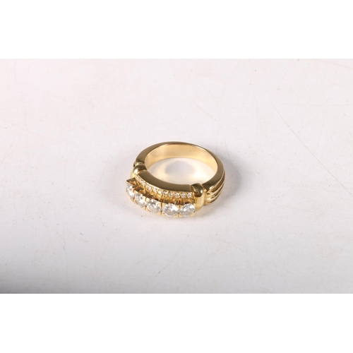 202 - Gold ring (markings rubbed), with five diamonds approximately .2ct each, flanked by chip diamonds, s... 