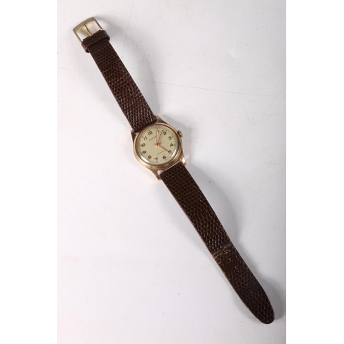 209 - 9ct gold cased Marvin gentleman's wristwatch on leather strap, dial 2.5cm.