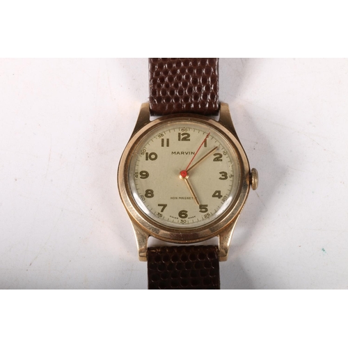 209 - 9ct gold cased Marvin gentleman's wristwatch on leather strap, dial 2.5cm.