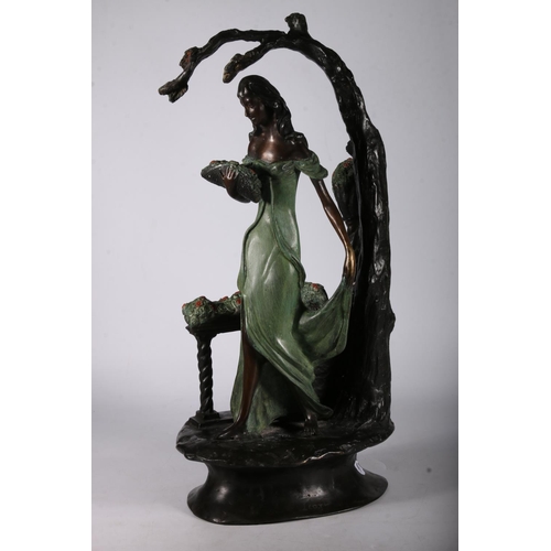 363 - Signed patinated bronze figure modelled as a painted clad female holding a basket of flowers, beside... 