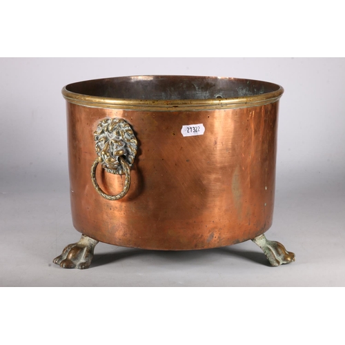 364 - Victorian copper and brass log bin with lion mask carrying handles to either side and raised on thre... 