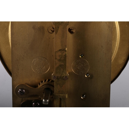 380 - Gustav Becker brass torsion clock the enamel dial with arabic numerals on a brass skeleton frame wit... 