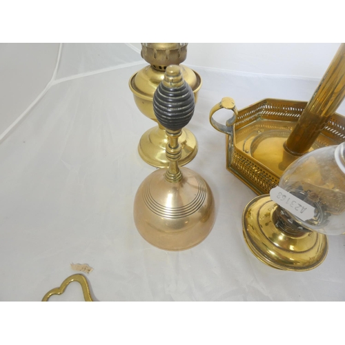 71 - Various brass ware to include oil lamps, candlestick etc.