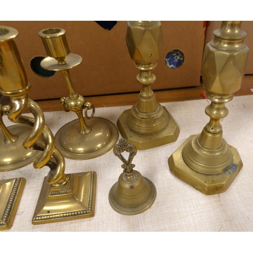 99 - Three pairs of brass candlesticks, a bowl and a bell.