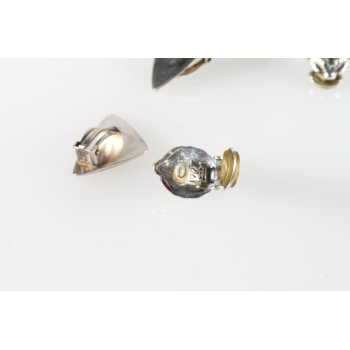 257 - Pair of Georg Jensen silver fin style clip on earrings, and another pair with foliate design and iri... 