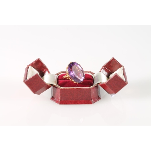 259 - Yellow metal cocktail ring with large oval cut crown set amethyst, size L, 12.5g.