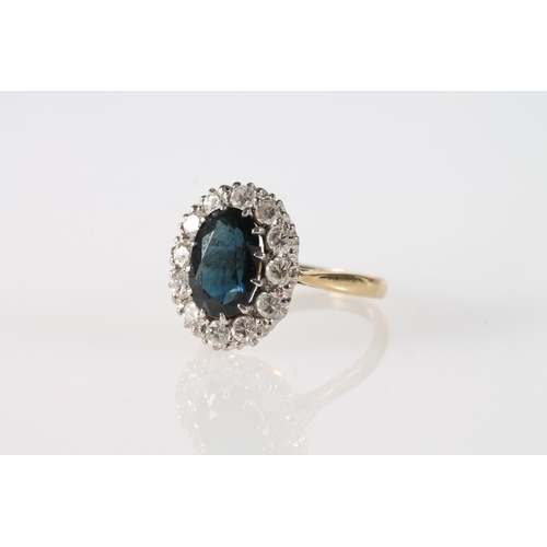 114 - 18ct gold cluster ring with twelve diamonds encircling blue/green oval cut stone, size P, 4.9g