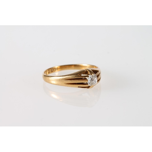 115 - 18ct gold ring with single diamond in channelled tapering setting, size Q, 3.7g.