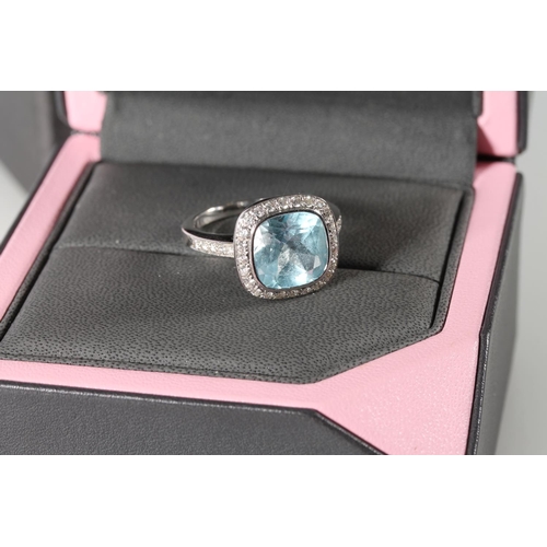 116 - 18ct white gold cocktail ring with square cut light blue stone encircled by diamond chips and also p... 